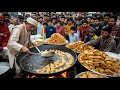 PAKISTANI HARDWORKING 55 YEAR S OLD MAN SELLING SAMOSA CHAAT ON THE ROADSIDE PAKISTAN STREET FOOD