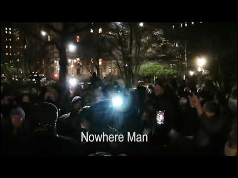 In Memory of John Lennon. New Yorkers singing at Strawberry fields in Central Park. Dec.08.2020