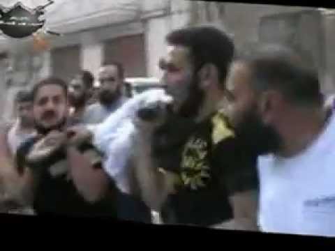 تشييع أيمن الديك أحد عناصر كتيبة سيف الله المسلول الذي قتل في حي القرابيص في مدينة حمص