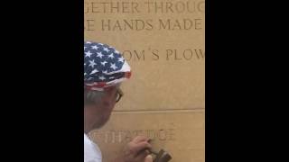 Mark Wickstrom chiseling the Labor Monument
