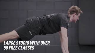 PureGym Cardiff Bay: Functional training area with turf track, battle ropes, weighted sleds.