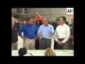 Bush tours hurricane-hit region, aerials