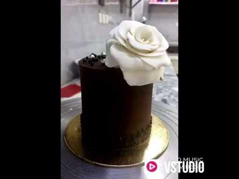 Dark chocolate cake with white rose topper