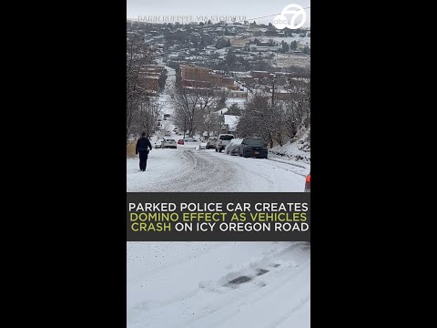 Parked police car creates domino effect as vehicles crash on icy Oregon road