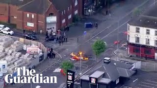Aerials from Belfast during anti-immigration protest following knife attack – watch live
