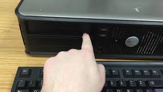 How to open the disc tray on a DELL computer