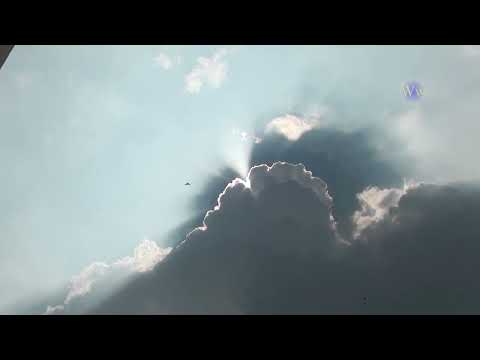 A STORM OF COLOR Time Lapse - Isolated Super-cell  rainbow and lightning storm.