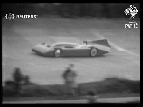 Sir Malcolm Campbell drives his car, Bluebird, around the track at Brooklands (1935)