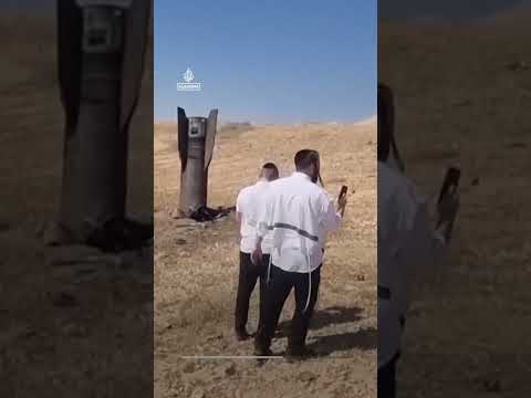 Missile fragment embedded in ground near Jericho in the occupied West Bank