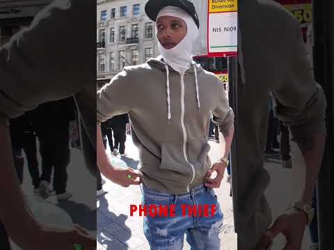 London thief trying to steal rider's phone off the bike, luckily spotted on time, robbery attempt.