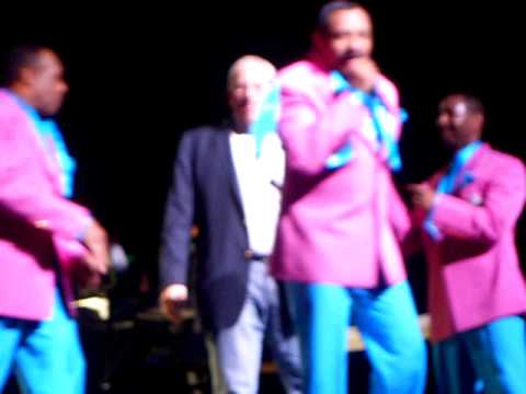 Marc singing with The Temptations