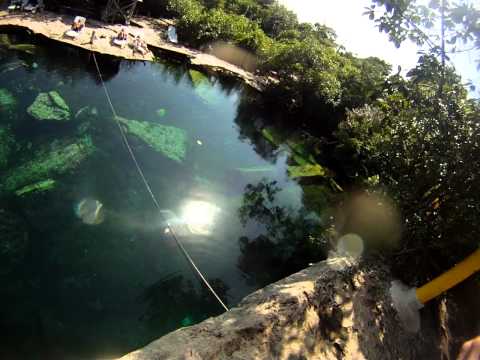 Cliff diving at Cenote Cristalino in Mexico
