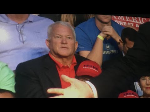 Ex-congressman Mark Foley sits behind Trump at rally