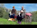 Happy old age of an elderly couple in a mountain village far from civilization