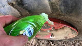Easy trick to get a tractor tire back on the rim!