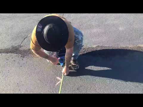 Solo parking lot striping New layout design with a cinder block