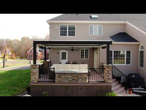 Custom deck with louvered roof, fire pit