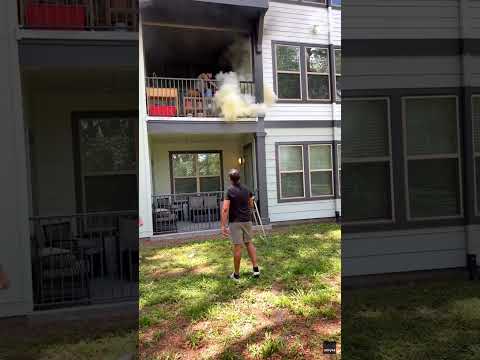 Watch a quick-thinking neighbor extinguish an apartment balcony blaze