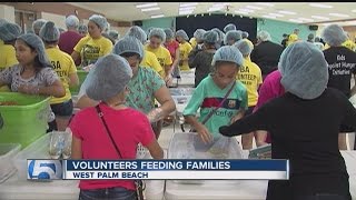 Volunteers gather food for local needy families