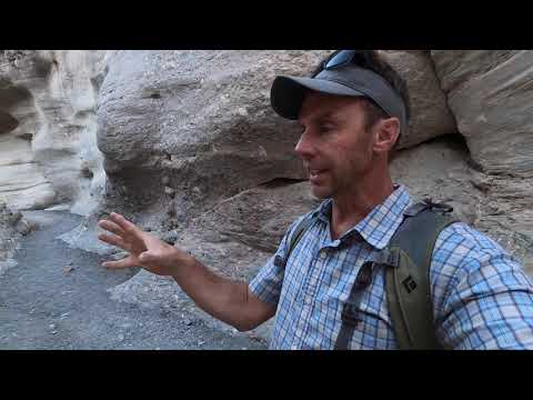 The narrow slot and beautiful rocks of Mosaic Canyon, Death Valley with a geology professor