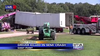 Truck driver killed after semi crashed into storage facility