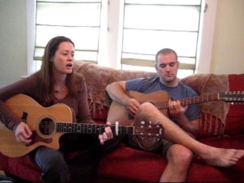 Melissa Mesko and Brian Mesko perfroming in the aeroplane over the sea - cover