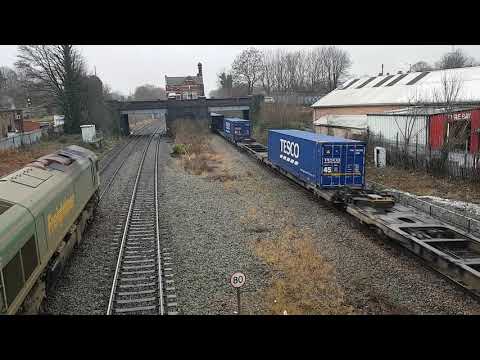 Water Orton Footbridge two way Containers 66424 410J & 66507 437J pass one another on 8 January 2021