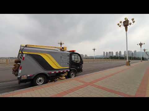 Electric road sweeper cleans the bridge