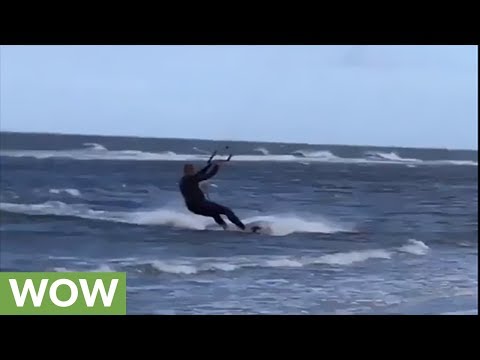 Kitesurfer makes insanely huge jump on windy day