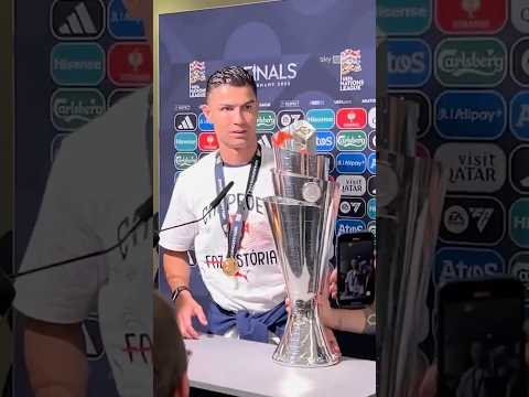 Bruno Fernandes brings the trophy to Cristiano Ronaldo during his interview!