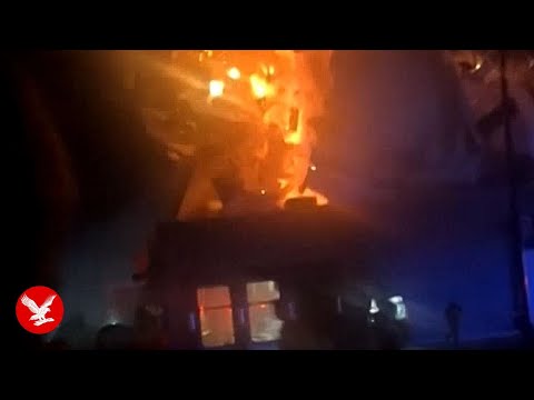 Explosion tears roof off Domino's Pizza after car crashes into restaurant