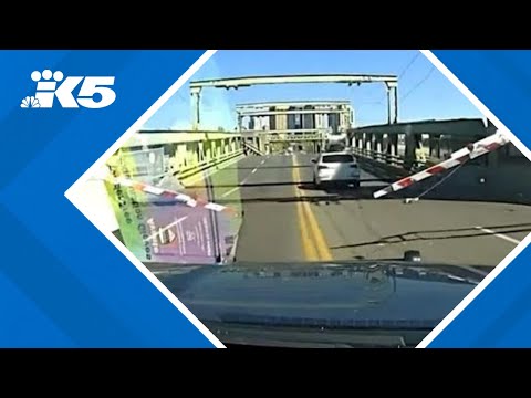 Dashcam video shows moments stolen vehicle jumps partially-open University Bridge