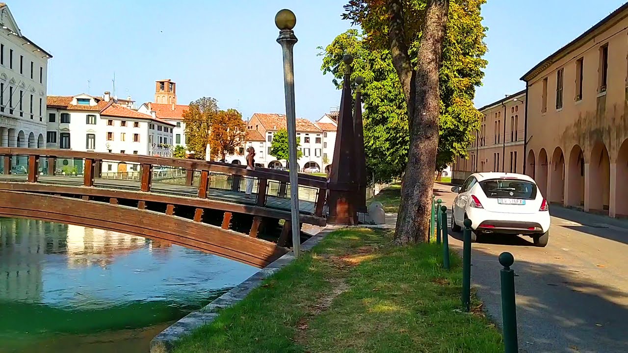 Immersive street-level walking tour through Treviso Canals, Italy, showcasing authentic urban landscapes, local architecture, and the vibrant atmosphere of the city's neighborhoods