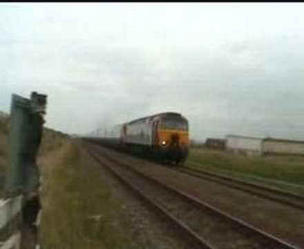 Class 57 and Pendolino pass at Towyn