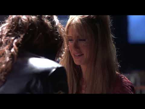 Rock Star (2001) theatrical trailer frame: Chris 'Izzy' Cole takes the arena stage as lights flare