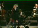 Vanina Bilous  and  Alejandro Aquino  are  dancing  to  the  tango  "  Recuerdo  "