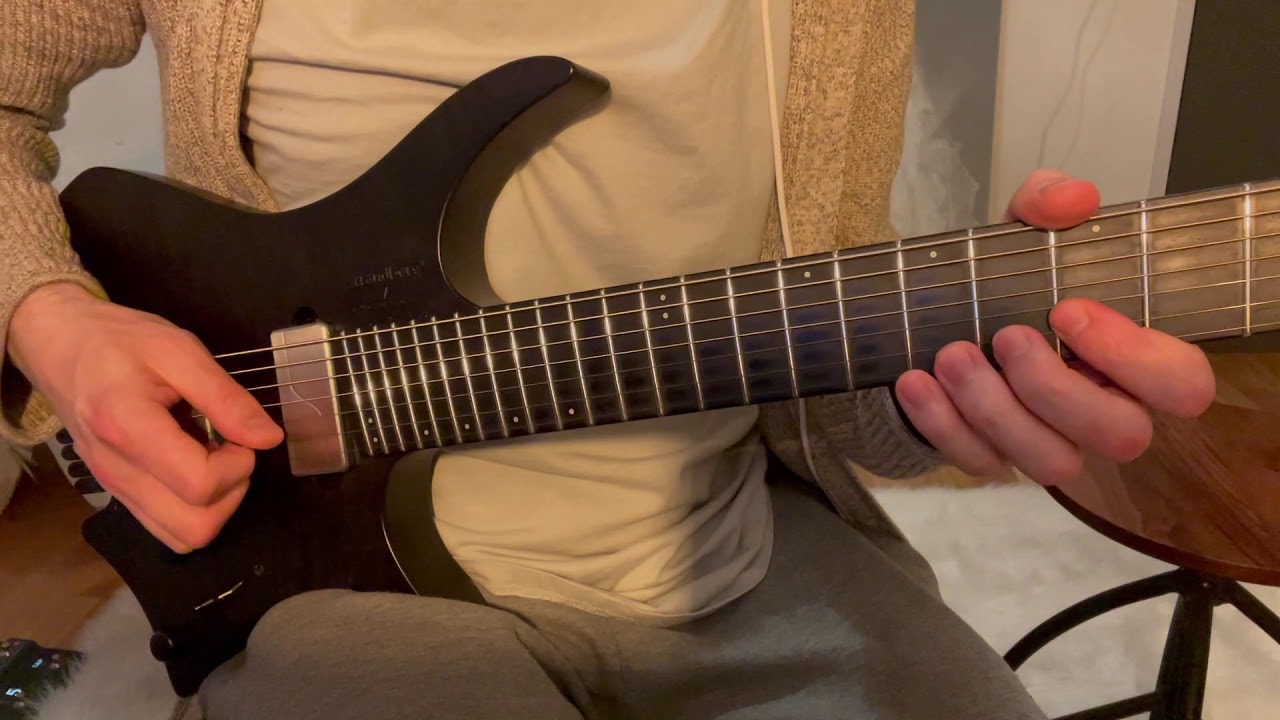 Guitarist demonstrating string bending licks on the fretboard, pushing a string up to pitch