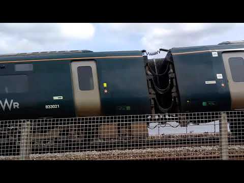 Trains. A GWR Class 802 IET alongside the Exe Estuary