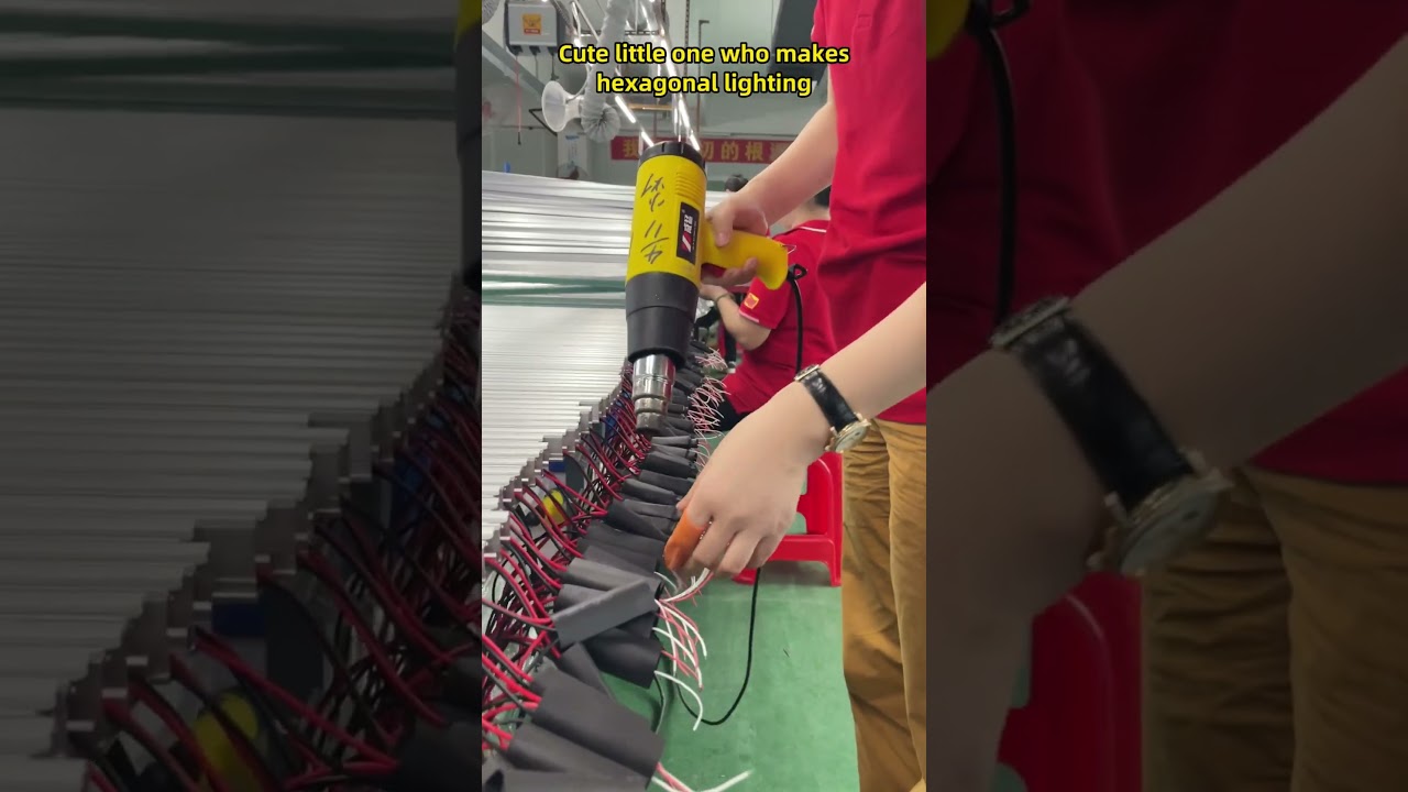 Discover the Remarkable Skills of Women Creating Hexagon Lights in a Vibrant Workspace