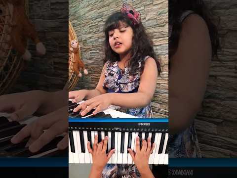 Little Girl Tathoi's Attempt at Singing & Piano Cover "Megher Kole Rod Hesheche"