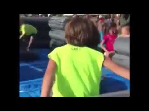 Kid keeps getting hit on inflatable arm obstacle