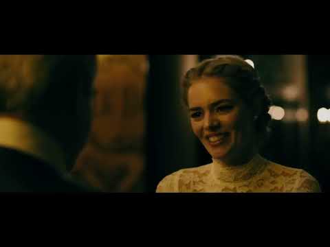 Ready or Not (2019) red-band trailer frame — Grace in a tattered wedding dress, the mansion’s lights burning as a sinister lullaby creeps in
