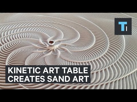 Table that creates sand art with marble that rolls by itself