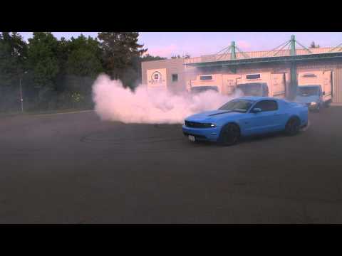 2012 Grabber Blue Mustang GT tearing it up. www.americanmuscle.com