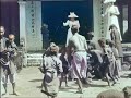 2 french woman tossing coins to children Vietnam, 1899 shot by Gabriel veyre