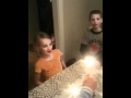 Kids light hanukkah candles
