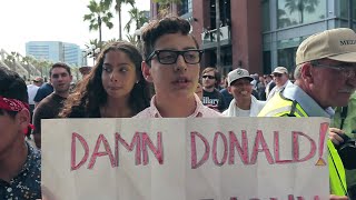 White Protester calls Hispanic Immigrant Trump supporters 