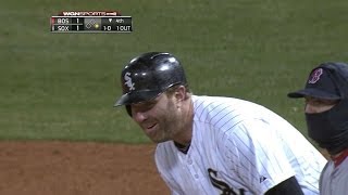 Jake Peavy playfully attempts to pick off Adam Dunn
