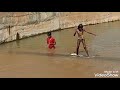 A village girl showing her stunt in the river