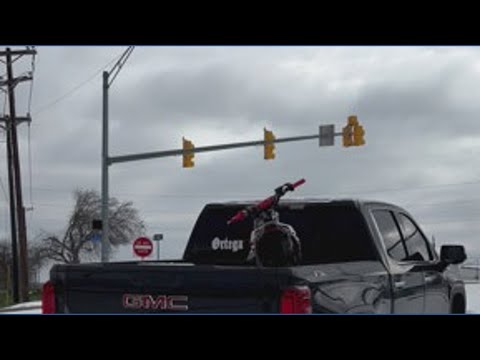 Pickup truck gets stuck on ice in Fort Worth, Texas